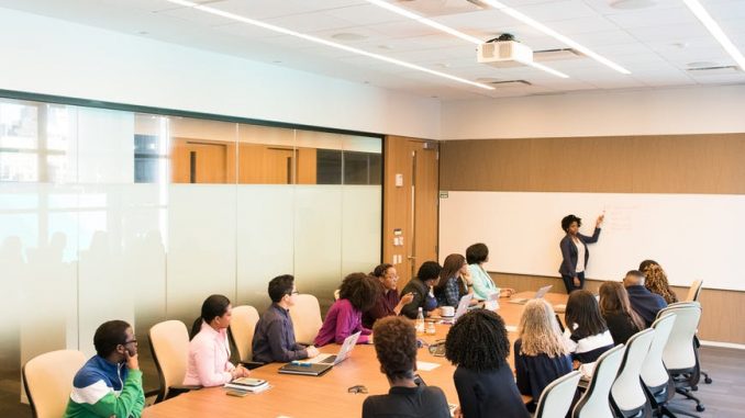 people having meeting inside conference room